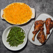 Fuss-free thanksgiving dinner spread with roasted turkey legs, baked mac and cheese, and garlic green beans