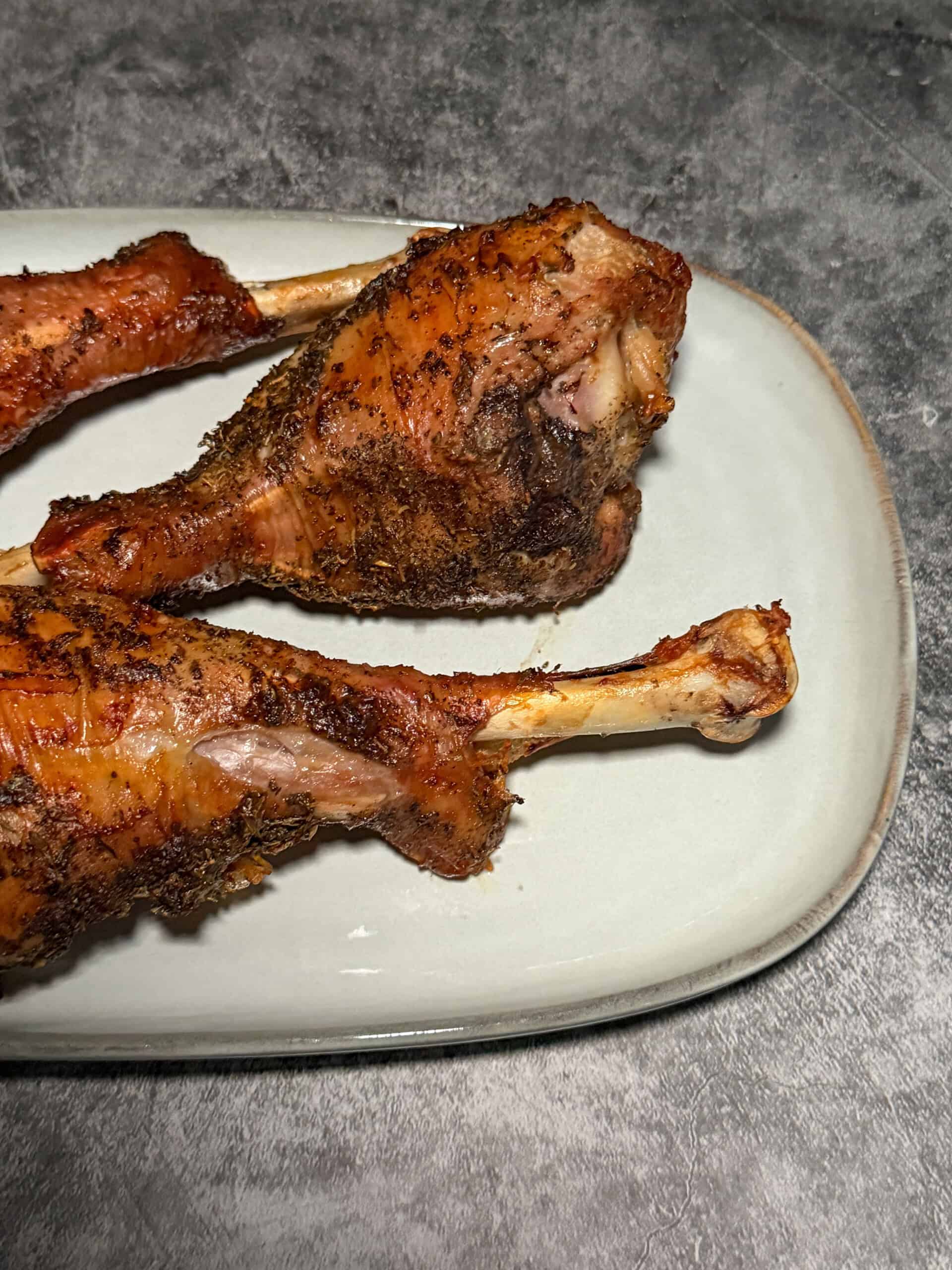 Complete Thanksgiving dinner plate with air fryer turkey drumstick, sides, and dinner roll